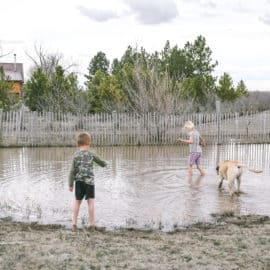 country kids in mud puddle